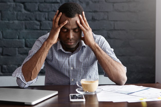 young businessman having bad headache